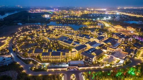 an aerial view of a city at night at Doubletree By Hilton Yancheng Dayangwan in Yancheng