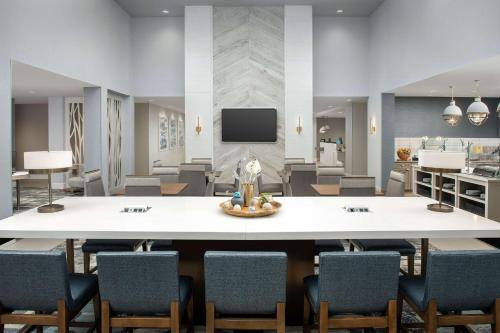 a large conference room with a large table and chairs at Homewood Suites By Hilton Destin in Destin