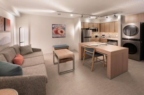 a living room with a couch and a table at Homewood Suites by Hilton Atlanta Buckhead Pharr Road in Atlanta