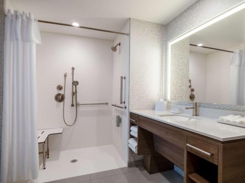 a bathroom with a shower and a sink at Home2 Suites By Hilton Santa Rosa Beach in Santa Rosa Beach