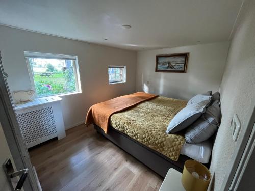 Postel nebo postele na pokoji v ubytování Plompeblad Guesthouse Giethoorn