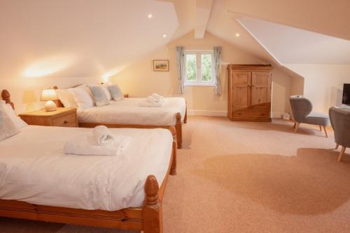 A bed or beds in a room at Spedding Fold Chapel Stile