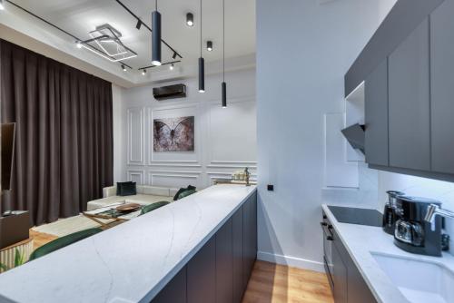 a kitchen with white walls and a counter top at PRO HOME SUİTES in Istanbul