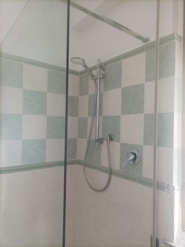 a shower in a bathroom with a glass door at Affitta camere Via Piave in Foligno