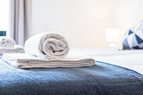 a towel sitting on top of a blue rug at Lagos Sea View by Algarve Golden Properties in Lagos