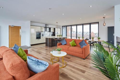 a living room with two couches and a table at Host & Stay - The Knight Street Penthouses in Liverpool
