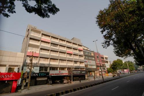 a building on the side of a city street at Hotel Asrani International in Secunderabad