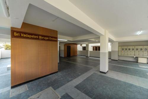 a lobby of a building with a sign that reads st wolfgang migrant mercy hospital at Fortune Inn in Erode