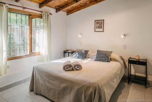Säng eller sängar i ett rum på Casa Bellavista Ushuaia