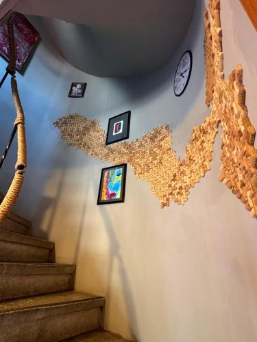 a room with a staircase with clocks on the wall at Nomad Hostel Karaköy in Istanbul