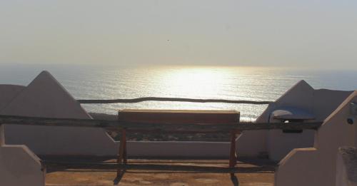 a view of the ocean from a balcony with a table at Riad Sahara Sunset Beach Agadir in Douaïra