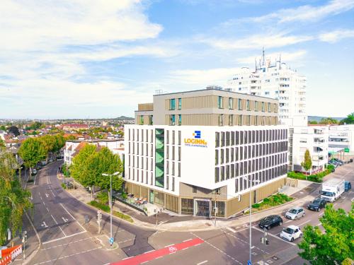 an aerial view of a building in a city at LOGINN Hotel Waiblingen in Waiblingen