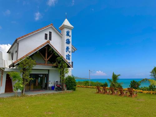 a church with a row of benches in front of it at Taitung Blue Sea Villa in Chenggong
