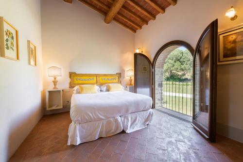 Ένα ή περισσότερα κρεβάτια σε δωμάτιο στο Villa San Cresci