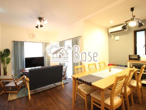 a dining room with a table and chairs at Base in Onnason,Okinanawa in Onna