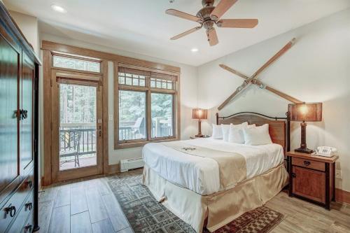 a bedroom with a bed and a ceiling fan at Lone Eagle Ski In Ski Out Condo in Dillon