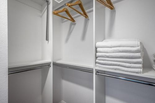 a walk in closet with white towels at Hollywood 2BR w Gym Pool Spa nr Sunset Blvd LAX-198 in Los Angeles