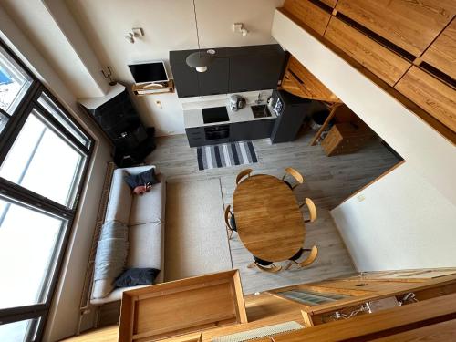 an overhead view of a living room and a table at HolySuites 2 - Ski-in and out apartment in the middle of ski slopes in Pyhä in Pyhätunturi