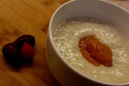 a bowl of cereal with a piece of food in it at Hotel Winoterra in Tbilisi City