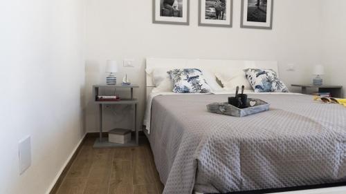 Postel nebo postele na pokoji v ubytování La Casa Di Marty Per 3