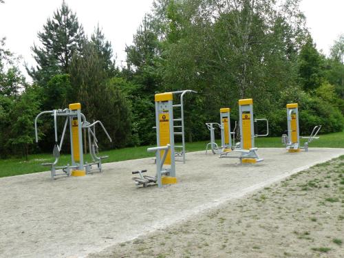 a row of exercise equipment in a park at HOTEL I RESTAURACJA BROCHÓW in Wrocław