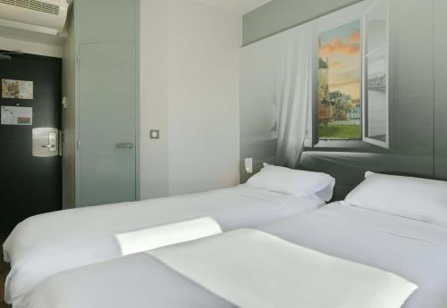Katil atau katil-katil dalam bilik di B&B HOTEL Le Mans Nord 1
