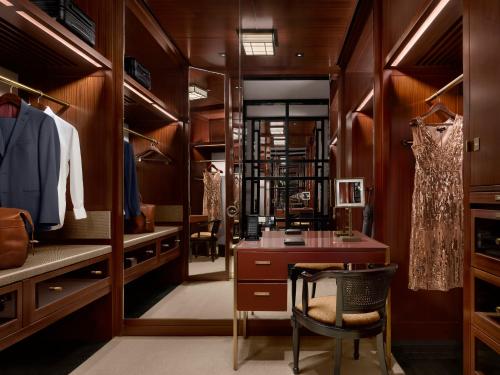 a dressing room with a table and a chair at The Peninsula London in London