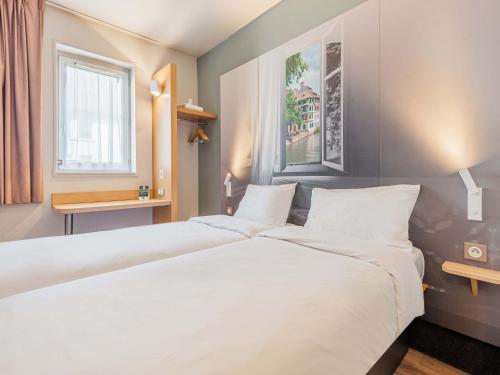 Postel nebo postele na pokoji v ubytování B&B HOTEL Strasbourg Sud Ostwald