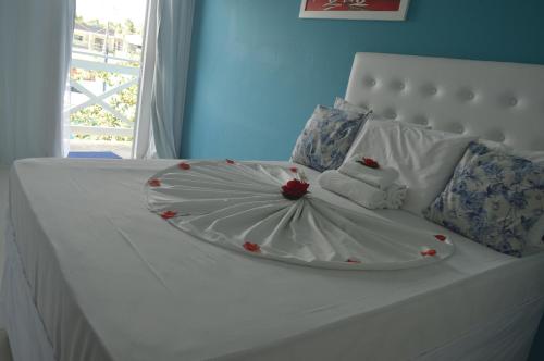 Uma cama ou camas num quarto em Pousada Vovó Zilda Maragogi