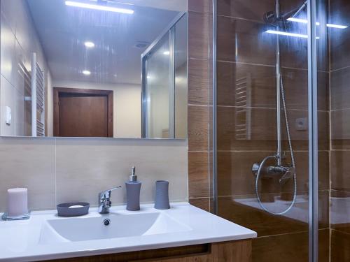 a bathroom with a sink and a shower at Casa do Souto - Nature & Experiences - Turismo Rural in Bragança