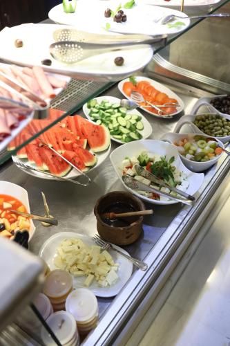 a buffet line with many different types of food at El Sheikh Suites Hotel in Beirut