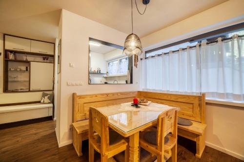a dining room with a table and chairs at Holzer's Apartment in San Leonardo in Passiria