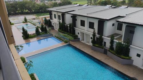 an aerial view of a house with a swimming pool at H&W Sunway Onsen Suite Tambun Sunway City Ipoh in Ipoh
