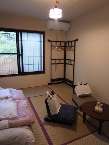 Postel nebo postele na pokoji v ubytování Guesthouse Engawa