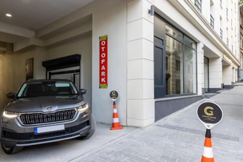 a car parked on a street next to a building at Carina Gold Hotel And Restaurant in Istanbul