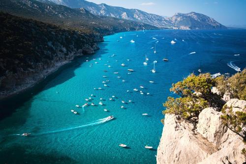 a view of a river with boats in the water at Casa Lia - Independent apartment in the Gulf of Orosei in Galtellì