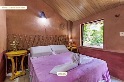 Tempat tidur dalam kamar di Pousada + café da manhã em Guaramiranga por Tactu