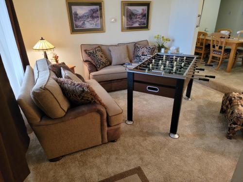 a living room with a chess board on a table at 3Br 2Ba Charming gem near shops, restaurants, and hospitals in Albuquerque