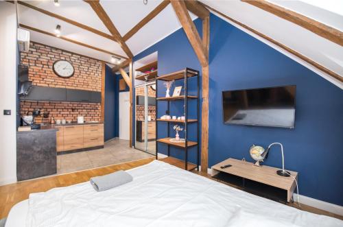 Posteľ alebo postele v izbe v ubytovaní Przytulny Apartament Z Wieżą