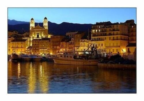 a view of a city with boats in the water at HAUT VILLA MESANGES EN BORD DE MER ! in Lucciana
