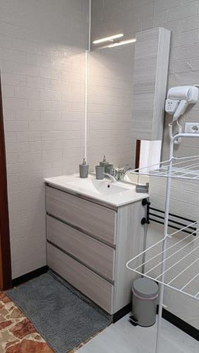 a bathroom with a sink and a mirror at 20 VENTI in Angolo Terme