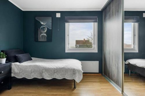 a bedroom with a bed and a window at House in Skien/Porsgrunn in Skien