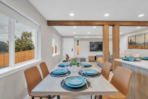 a dining room and living room with a table and chairs at Pacific Northwest Retreat Duplex 3min from Seattle in Tukwila