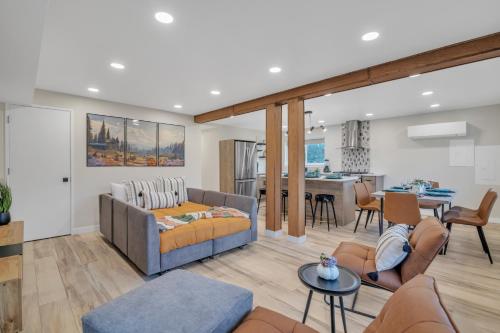 a living room with a couch and a table at Pacific Northwest Retreat Duplex 3min from Seattle in Tukwila
