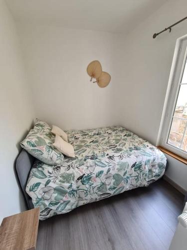 Ліжко або ліжка в номері Joli appartement tout confort