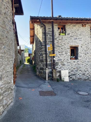 an alley in an old stone building at chalet st michel de maurienne in Beaune
