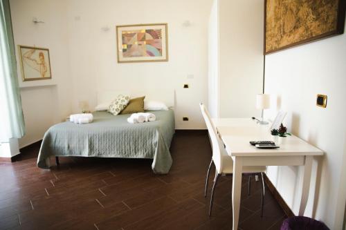 A bed or beds in a room at Palazzo de Brado