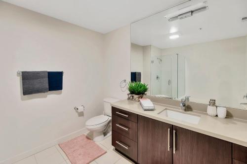 a bathroom with a sink and a toilet at 5 Heart of Santa Monica apartment in Los Angeles