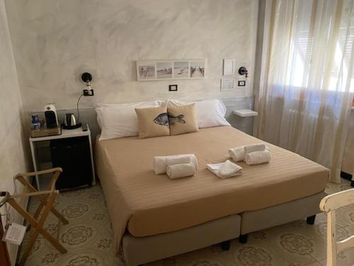 Un pat sau paturi într-o cameră la L'Antico Borgo Elena Noli