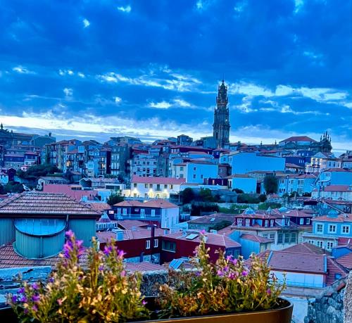 a view of a city with a clock tower at Urban Apartment Casa da Portela in Porto